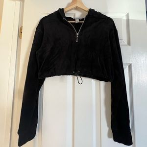Black suede cropped long sleeve with zipper and adjustable elastic on bottom